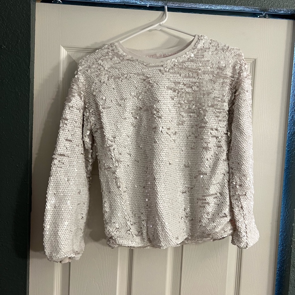 White sequin pull over sweat shirt for girls.